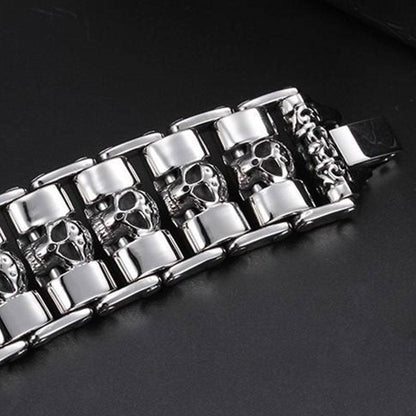 A Stainless Steel Fashion Wide Skull Bracelet, 8.3 x 0.9 in featuring a series of linked skull designs in a striking medieval style.