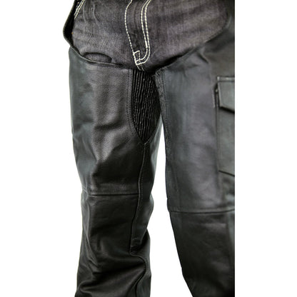 Close-up view of black leather chaps worn over dark jeans, featuring elastic panels and contrast stitching near the hip area, perfect Vance Leather Zip-Out Insulated and Lined Plain Biker Leather Chaps, Unisex for a rugged look.