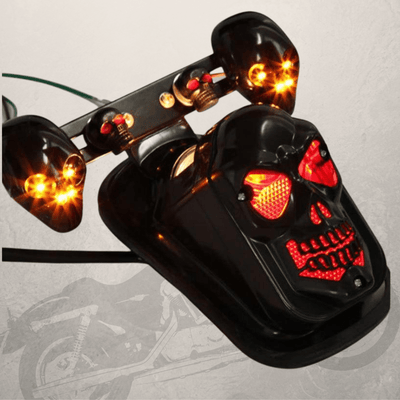 A Motorcycle Skull Tail Lights with Turn Signals with skull headlight and turn signal on it.