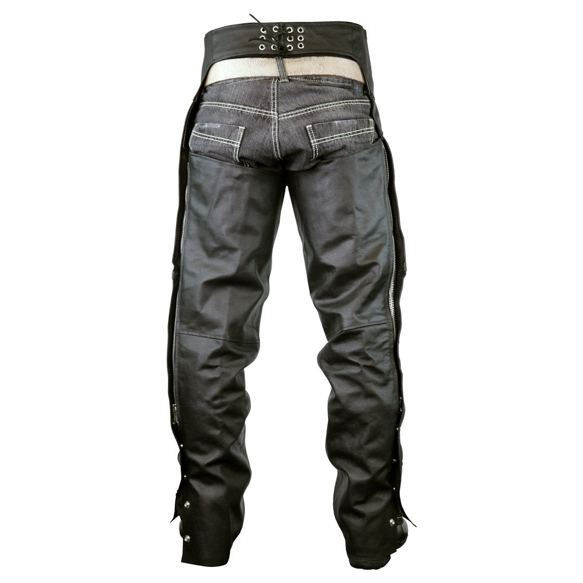 Back view of a person wearing the Vance Leather Zip-Out Insulated and Lined Plain Biker Leather Chaps, Unisex over faded blue jeans.