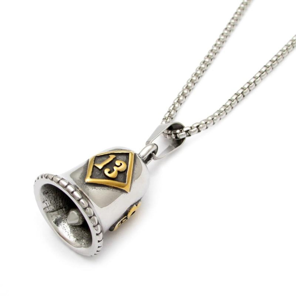 A Lucky 13 Gremlin Bell pendant on a motorcycle chain.