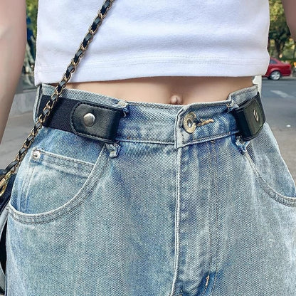 Close-up of a person in light blue jeans with a Buckle-Free Elastic Belt, suitable for waists 33.5-49 inches, and a white cropped top, standing outside.