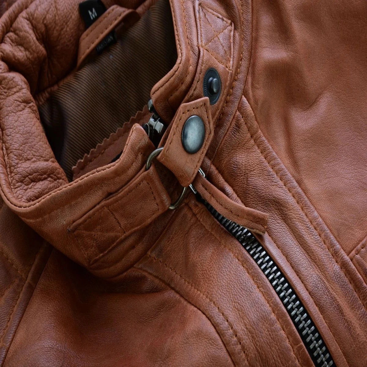 A close up of the Vance Cafe Racer Austin Brown Leather Jacket, a functional and fashionable lambskin leather jacket.