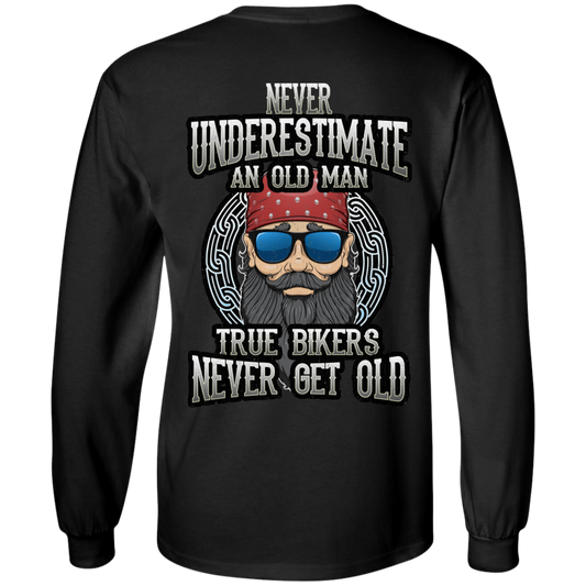 The True Bikers Never Get Old Long Sleeves is a black long-sleeve shirt featuring a digital print illustration of an old man wearing a red bandana and sunglasses. The text reads: "Never Underestimate An Old Man. True Bikers Never Get Old." Made from 100% cotton with unisex sizing, this shirt blends style and comfort perfectly.