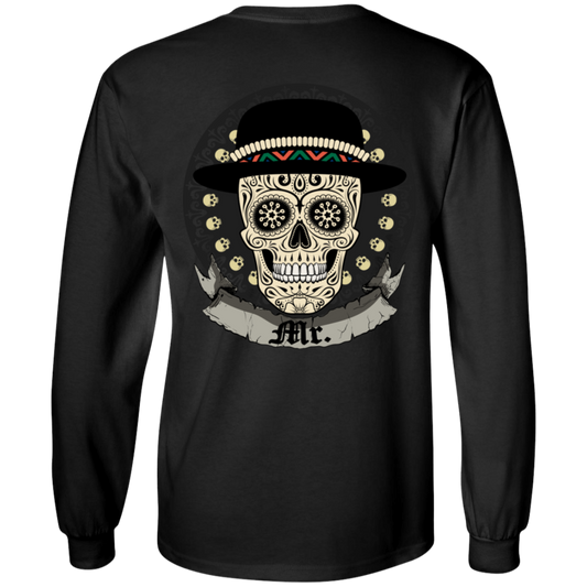 The Mexican Skull Long Sleeves is a black, long-sleeve shirt crafted from 100% cotton. It showcases a vibrant and detailed digital print of an ornate skull adorned with a mustache and hat, surrounded by decorative elements and featuring a scroll with "Mr." on it. This unisex shirt offers versatile sizing for all wearers.