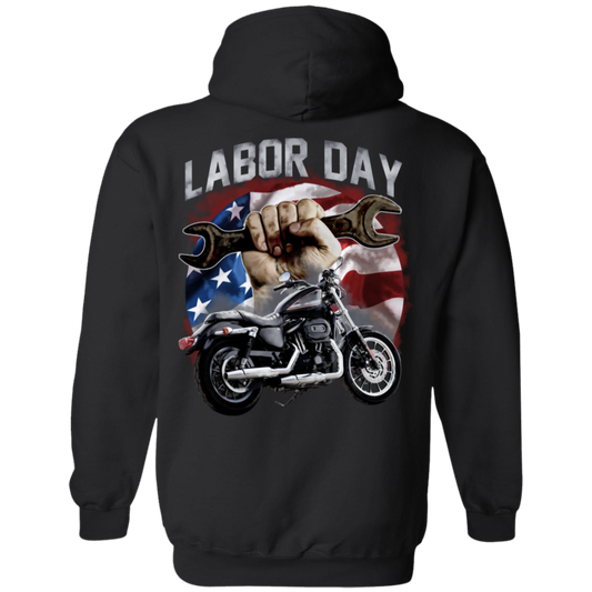 The Labor Day Hoodie boasts a striking design showcasing a hand gripping a wrench, a motorcycle, and an American flag in the background. Crafted from a cozy cotton/polyester blend and featuring unisex sizing, this hoodie is ideal for anyone looking to celebrate their holiday spirit in style.