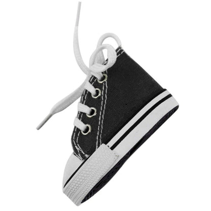 Motorcycle Foot Support Shoes: A small black sneaker featuring white laces and a white sole, angled to the right on a white background—ideal for motorcycle enthusiasts seeking stylish footwear.