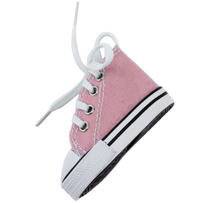 The Motorcycle Foot Support Shoes are a pair of small pink canvas sneakers featuring white laces and a rubber sole, ideal for motorcycle enthusiasts looking for lightweight foot support. Displayed against a plain background.