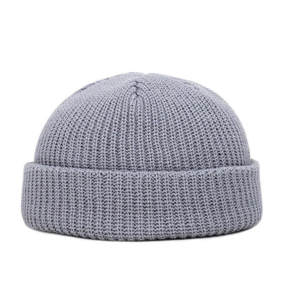 A Wool Knitted Skull Cap Beanie, perfect for winter, displayed on a clean white background.