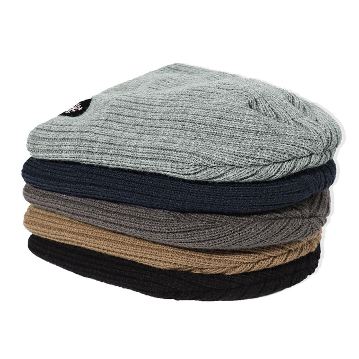 Four soft and warm Knitted Winter Beanie Hats stacked on top of each other.