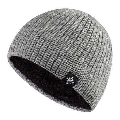 A {Knitted Winter Beanie Hat} with a snowflake on it.