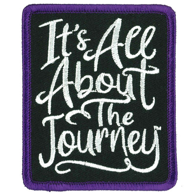 The Hot Leathers 3" It's All About the Journey Patch boasts white text on a black background with a striking purple border, proudly displaying the phrase "It's All About The Journey." This iron-on patch includes a convenient heat-sealed backing for effortless application.