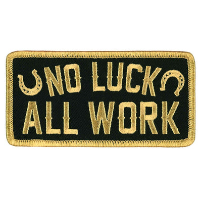 The Hot Leathers 4" No Luck All Work Patch is a rectangular patch featuring a black background and gold border. The words "NO LUCK ALL WORK" are displayed in gold letters, flanked by two small horseshoe symbols. This patch can be ironed on or sewn onto clothing for a stylish touch.