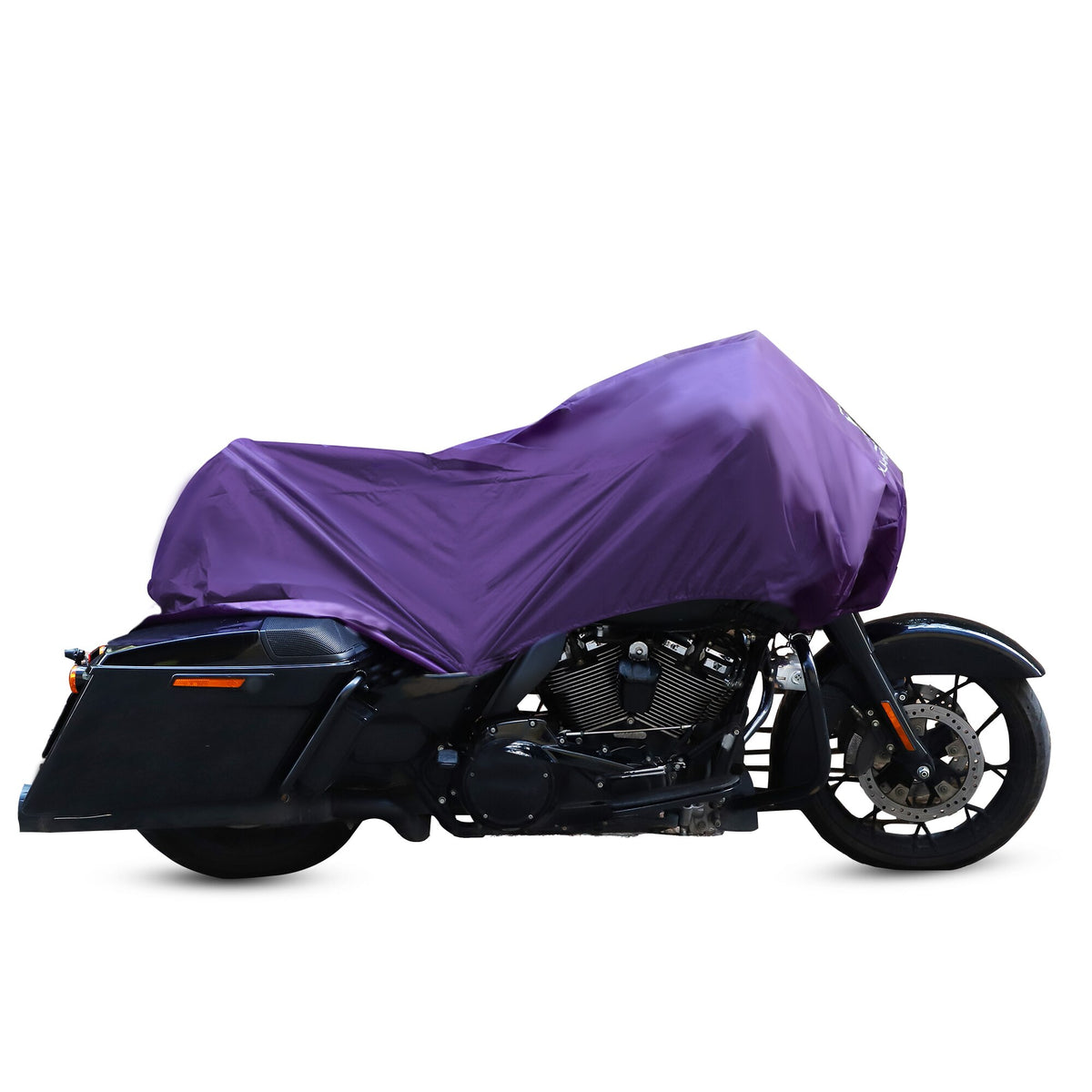 A Waterproof Motorcycle Half Cover made from 210T polyester fabric in purple elegantly drapes over a parked motorcycle, providing reliable protection.