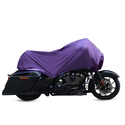 A motorcycle sits beneath the Waterproof Motorcycle Half Cover, providing thorough protection. This cover is crafted from 210T polyester fabric, ensuring durability and security while withstanding the elements.