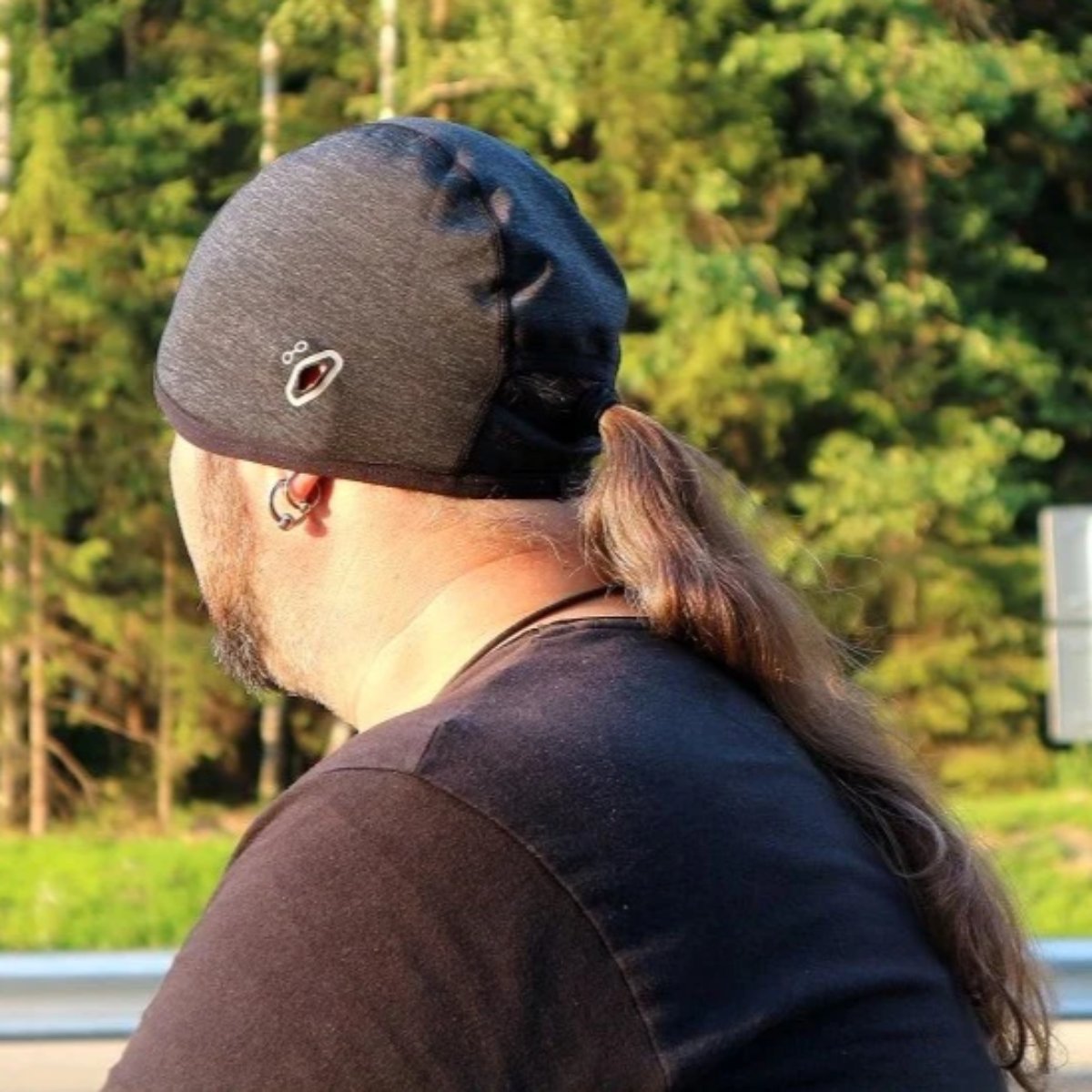 A man sporting a Motorcycle Helmet Liner Cap.