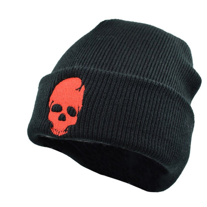 A black Winter Beanie w/ Embroidered Skull Design.