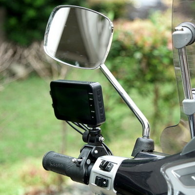 A water-resistant Motorcycle Dual Lens Dash Camera Video Recorder 4 Inch HD 1080P with a compact mirror attached to the handlebar.