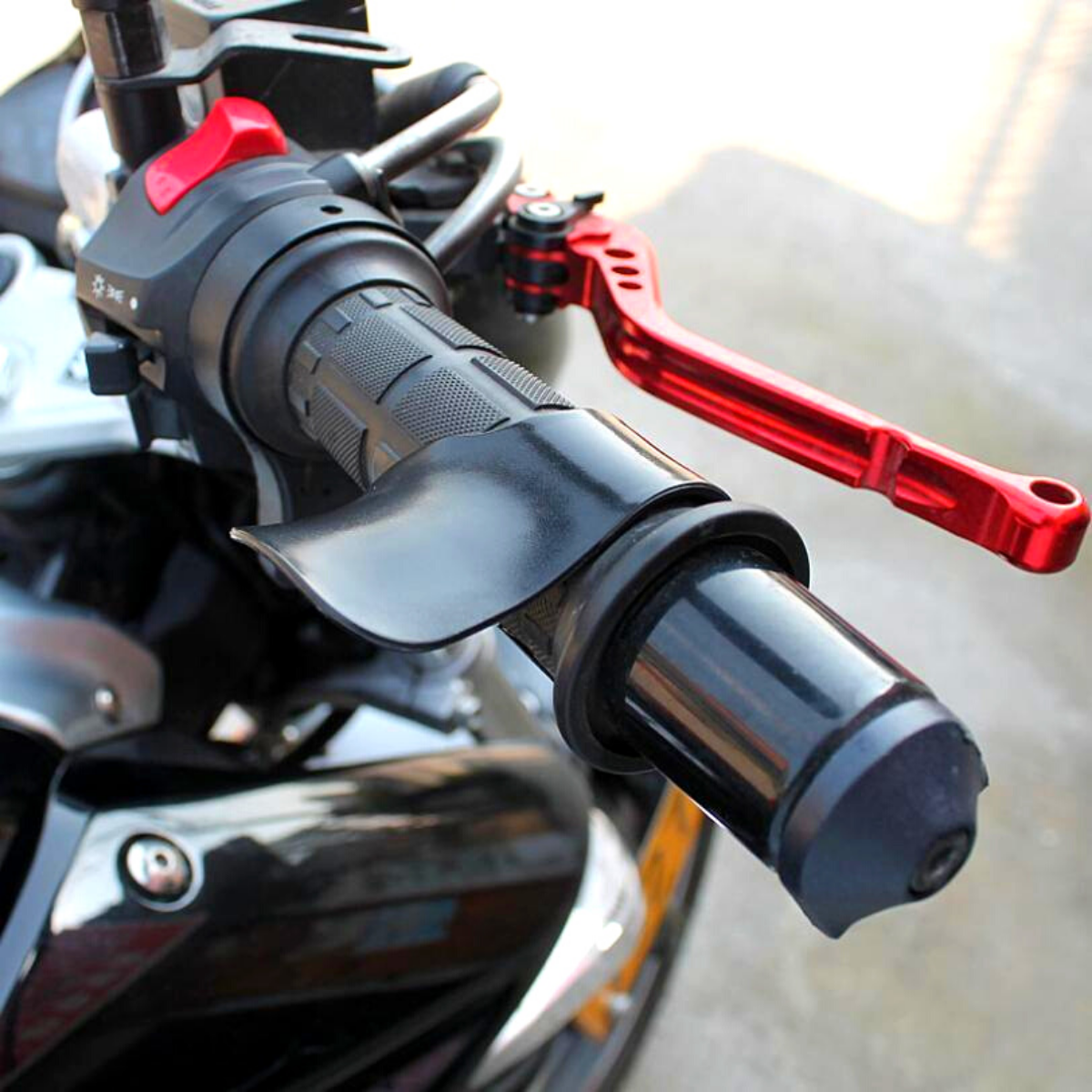 Motorcycle handlebars with universal throttle cruise control attached.