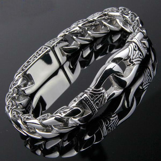 A Stainless Steel Vintage Charm Bracelet for Bikers with an ornate design.
