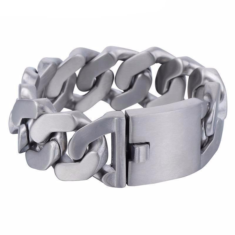 This men's bracelet, the Stainless Steel Heavy Thick Chain Bracelet, features a wide clasp and is crafted from rust-resistant stainless steel in a silver color with a 1-inch width and 0.2-inch thickness, making it both stylish and durable.