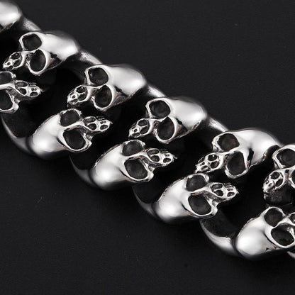 A Stainless Steel Men's Punk Skull Bracelet, Silver with skulls on it.