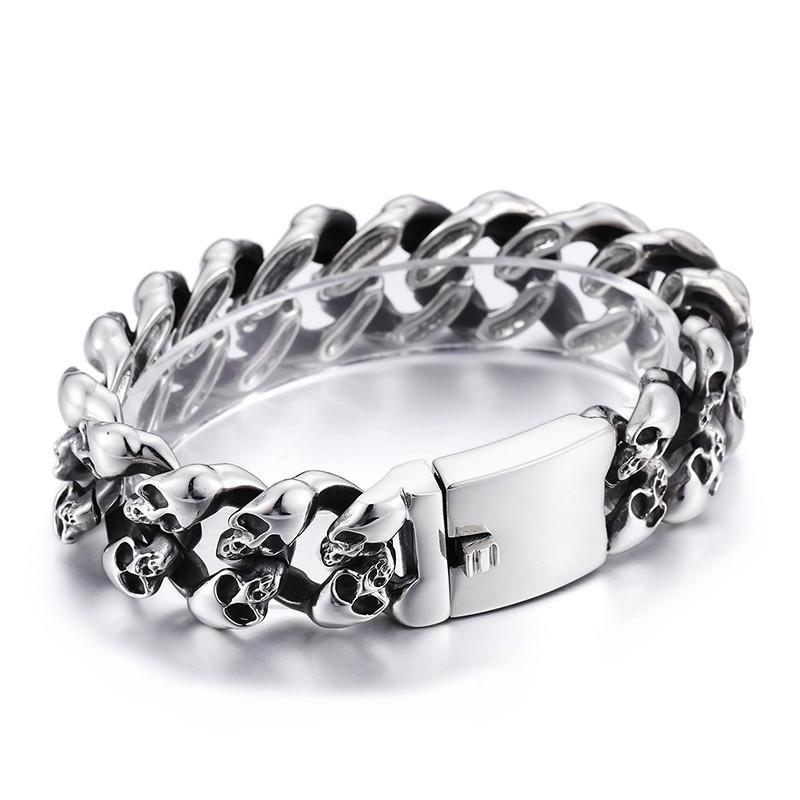 A Stainless Steel Men's Punk Skull Bracelet, Silver with skulls on it.