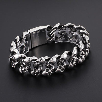 A Stainless Steel Men's Punk Skull Bracelet, Silver with skulls on it.