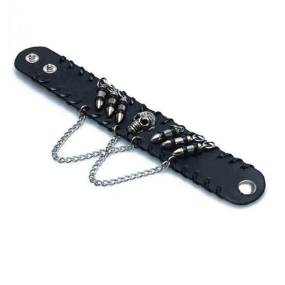 A black leather skull bracelet with metal skull head details.