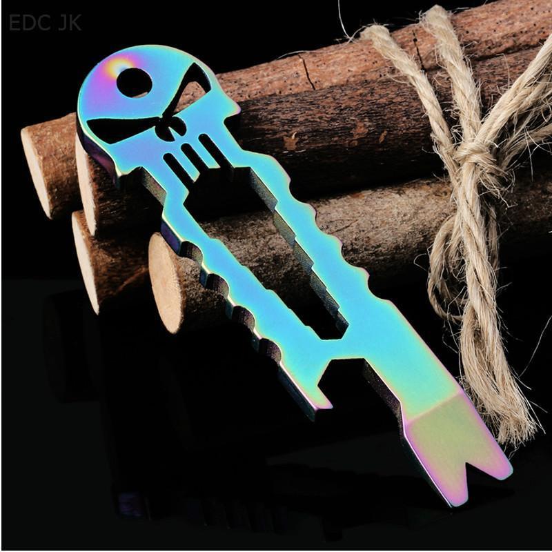 A Skull Survival Tool Keyring with a skull and crossbones on it.