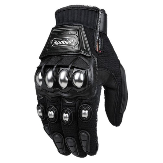 Motorcycle rider wearing Madbike gloves, gripping the handlebars.