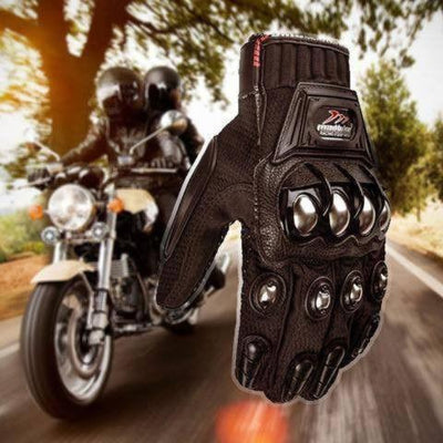 A pair of Madbike Motorcycle Gloves providing hand protection on a road.
