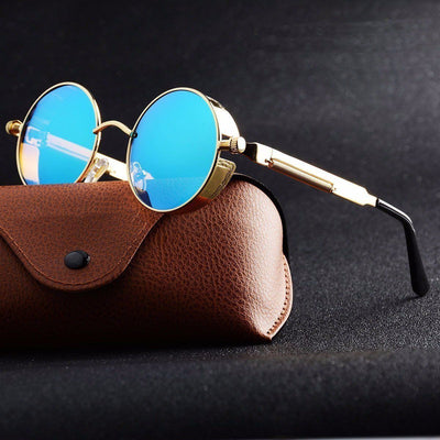 A pair of Rebel Sunglasses with blue lenses and a brown case.