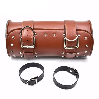 A Motorcycle Leather Duffle Roll Bag with straps and cuffs.