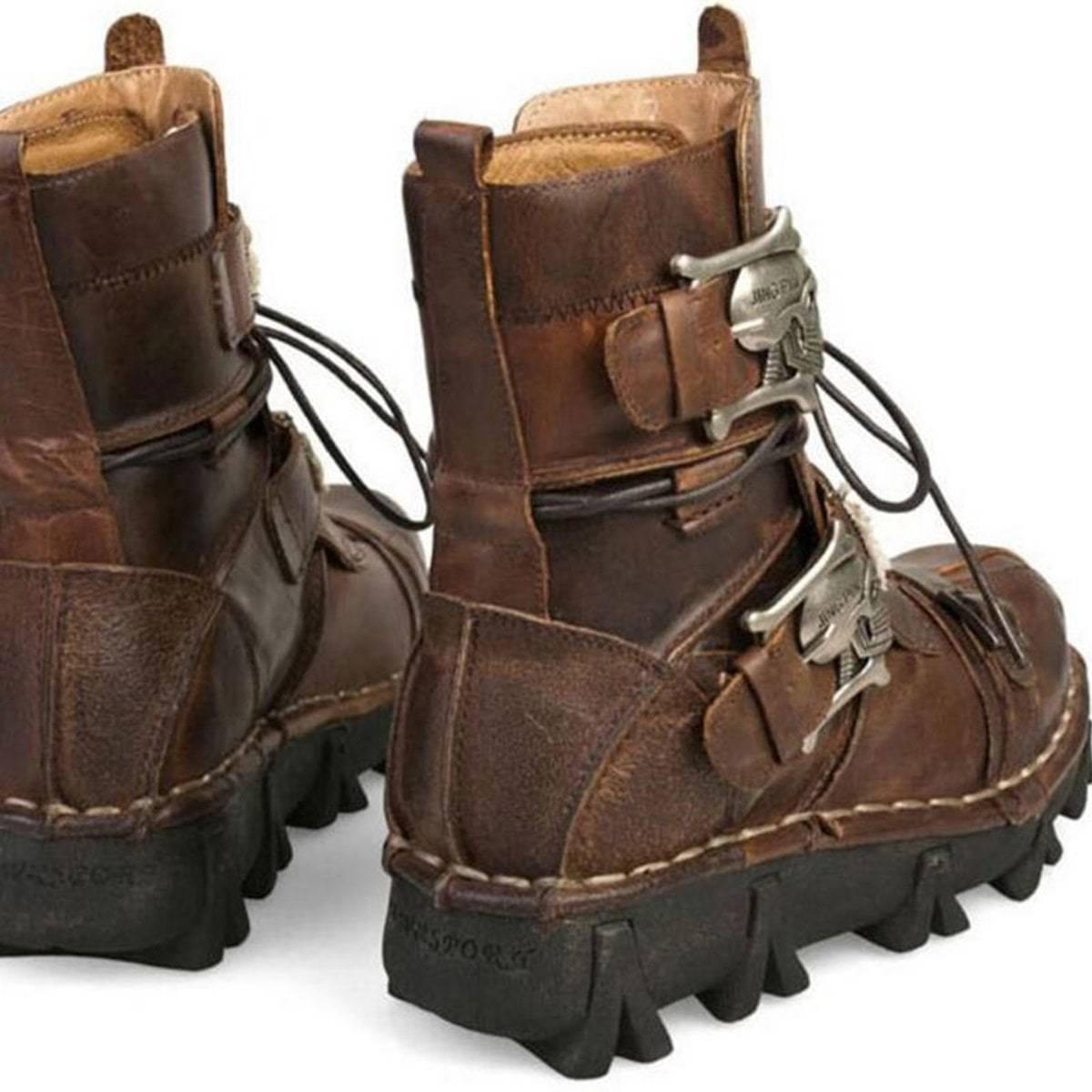 A pair of Handmade Leather Skull Boots with metal buckles.