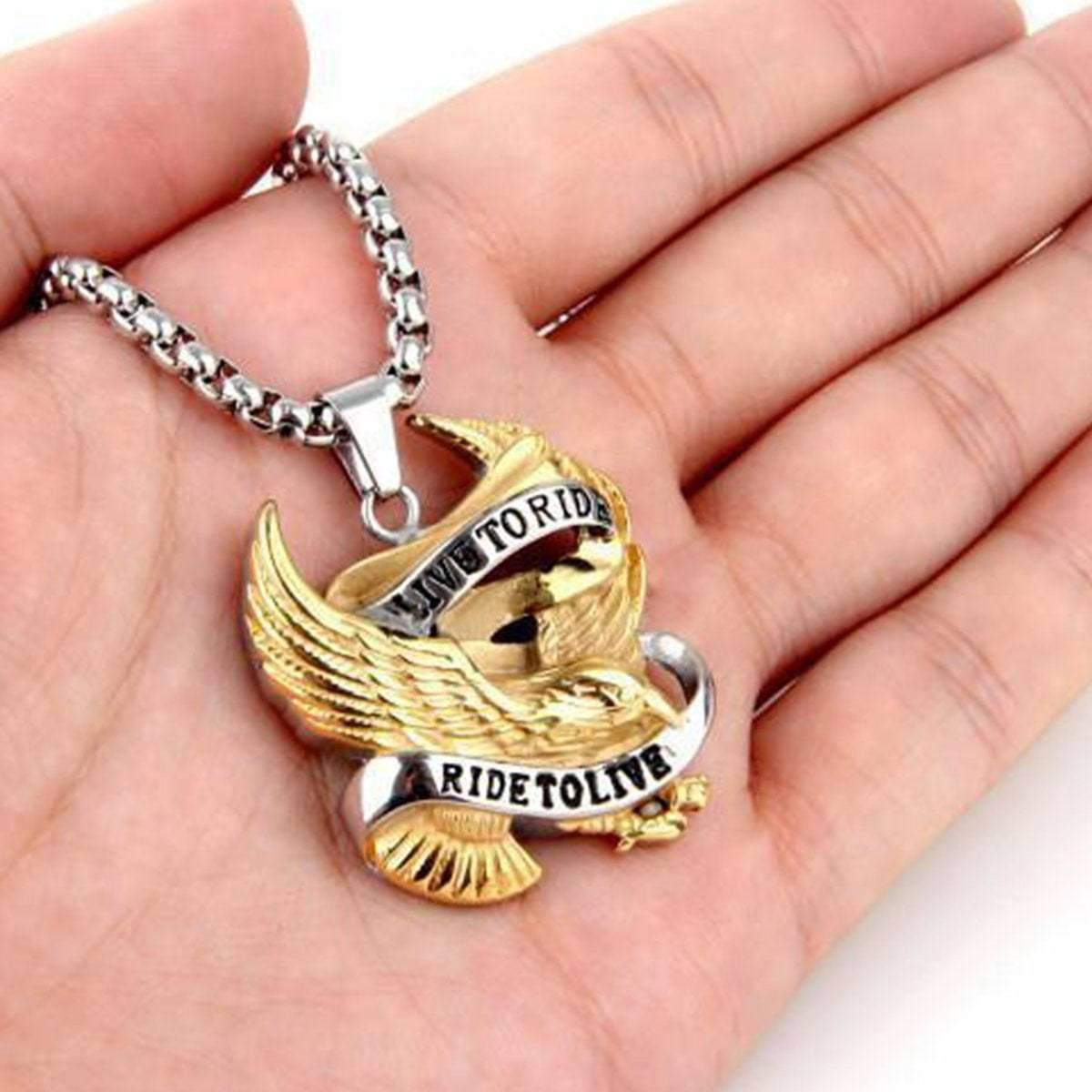 A person holding a Bikers Live To Ride, Ride To Live Necklace, Eagle Pendant w/ Stainless Steel 20 in Box Chain.