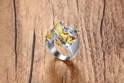 A Live to Ride Ring silver and gold ring with an eagle on it.