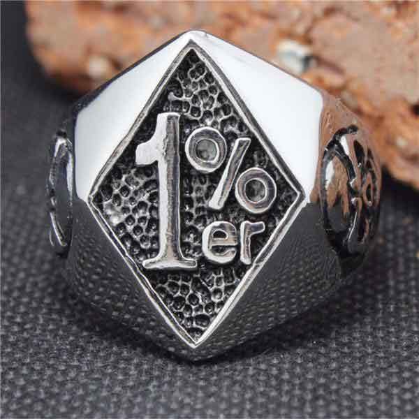 A 1%ER Man Ring with a 1 percent symbol on it.