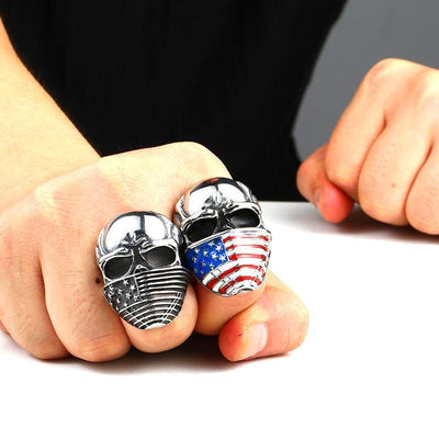 A person wearing a Stainless Steel Men's American Flag Skull Ring, Silver Color.