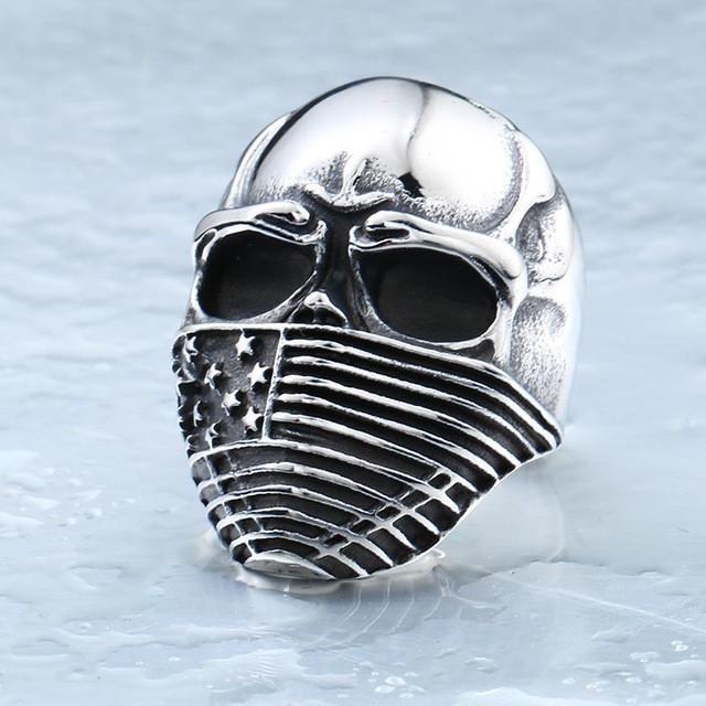 A Stainless Steel Men's American Flag Skull Ring, Silver Color with an american flag on it.