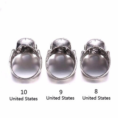 A set of three Zinc Alloy Gothic Skull & Bones Biker Rings, Silver Tone with the united states on them.