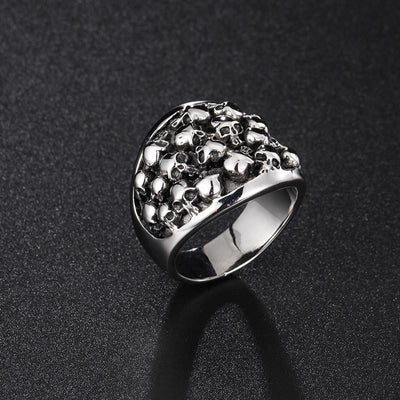 A Stainless Steel Bikers Skeleton ring with skulls on it.