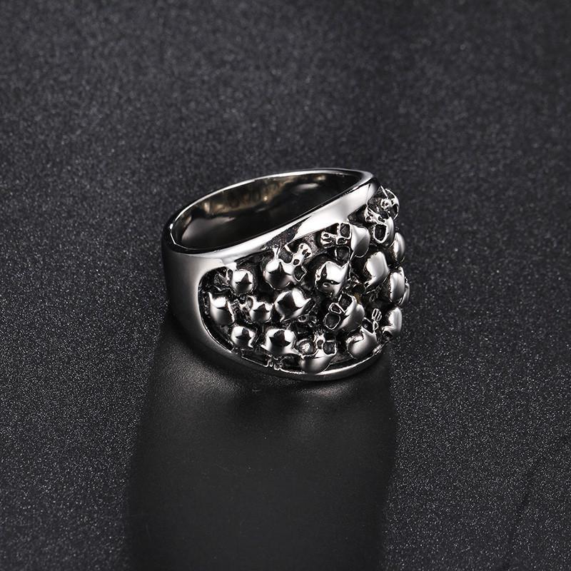 A Stainless Steel Bikers Skeleton Ring with skulls on it, perfect for those who love the Stainless Steel Bikers Skeleton Ring style.