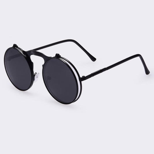 A pair of Vintage Motorcycle Glasses with a black frame and black lenses.