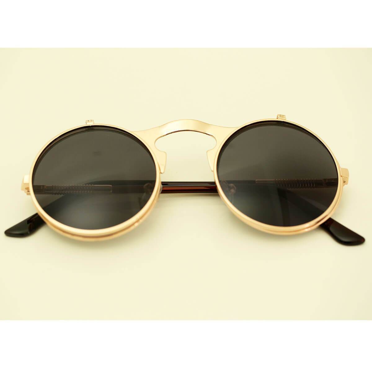 A vintage pair of Steampunk Flip-Up Round Double Lens Sunglasses perfect for outdoor activities.
