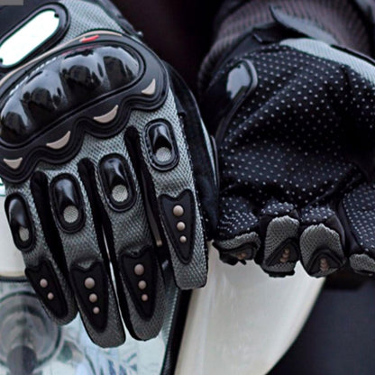 A pair of Alr™ Pro-Biker Series Waterproof Motorcycle Gloves on a motorcycle.