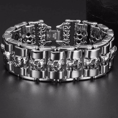A Stainless Steel Fashion Wide Skull Bracelet, 8.3 x 0.9 in featuring a pattern of small skull designs arranged around the band, displayed against a black background. The medieval style bracelet combines classic charm with an edgy twist.