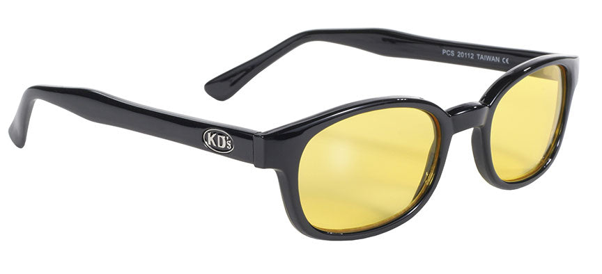 Daniel Smart KD's Blk Frame/Yellow Lens sunglasses feature a black frame and yellow-tinted polycarbonate lenses, with "Kid's" inscribed on the sidearms to provide UV protection for young eyes.