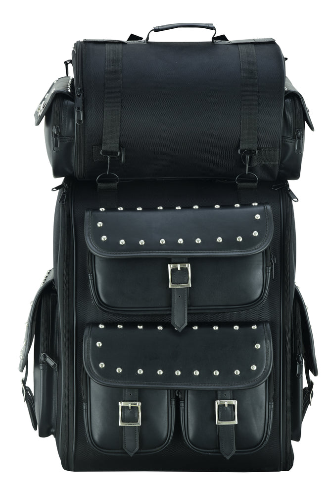 The Daniel Smart Updated Touring Back Pack With Studs is a large black motorcycle bag with multiple compartments, buckles, and silver stud accents, arranged in a stacked formation. This water- and weather-resistant bag also features adjustable mounting for convenience.