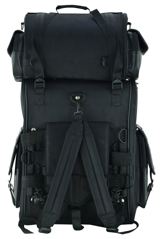 The Daniel Smart Updated Touring Back Pack With Studs is a large black tactical backpack engineered for heavy-duty use. It boasts multiple compartments, straps, and buckles and is designed as a motorcycle bag with water-weather resistance. Additionally, it features adjustable mounting options for versatile and secure attachment.